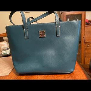 Dooney and Bourke leather teal tote with zip top. Gently used. With dustbag.